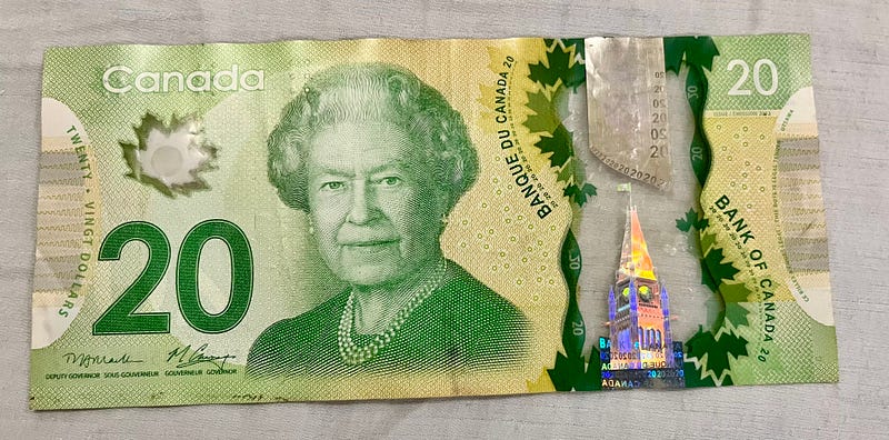 Canadian dollar bill featuring a hologram