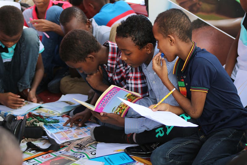 A young student finding satisfaction in completing homework