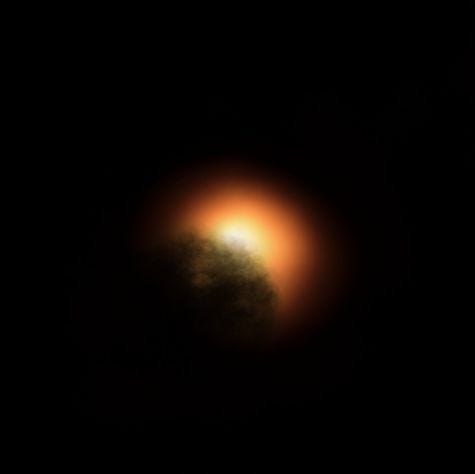 Conceptual image of dark material overshadowing Betelgeuse